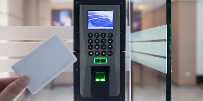 Biometric and RFID multi-factor access control system with zone-based security tiers